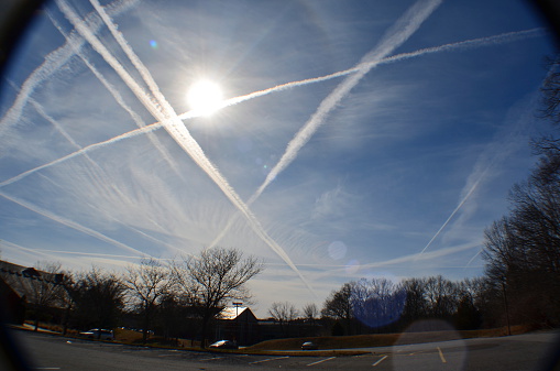 Sky filled with chemtrails or contrails.